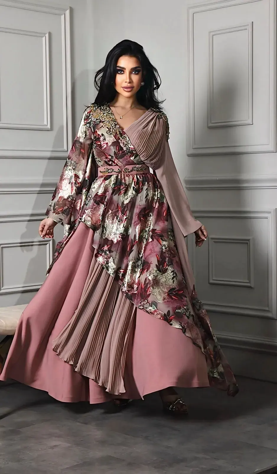Model in a rose wrap dress with a floral bodice and pleated skirt
