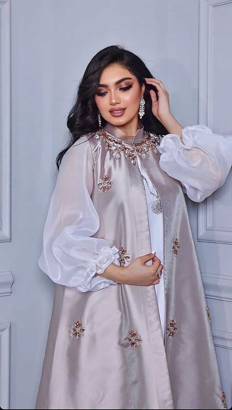 Model in a lilac-grey satin set with sheer organza sleeves and beaded flowers