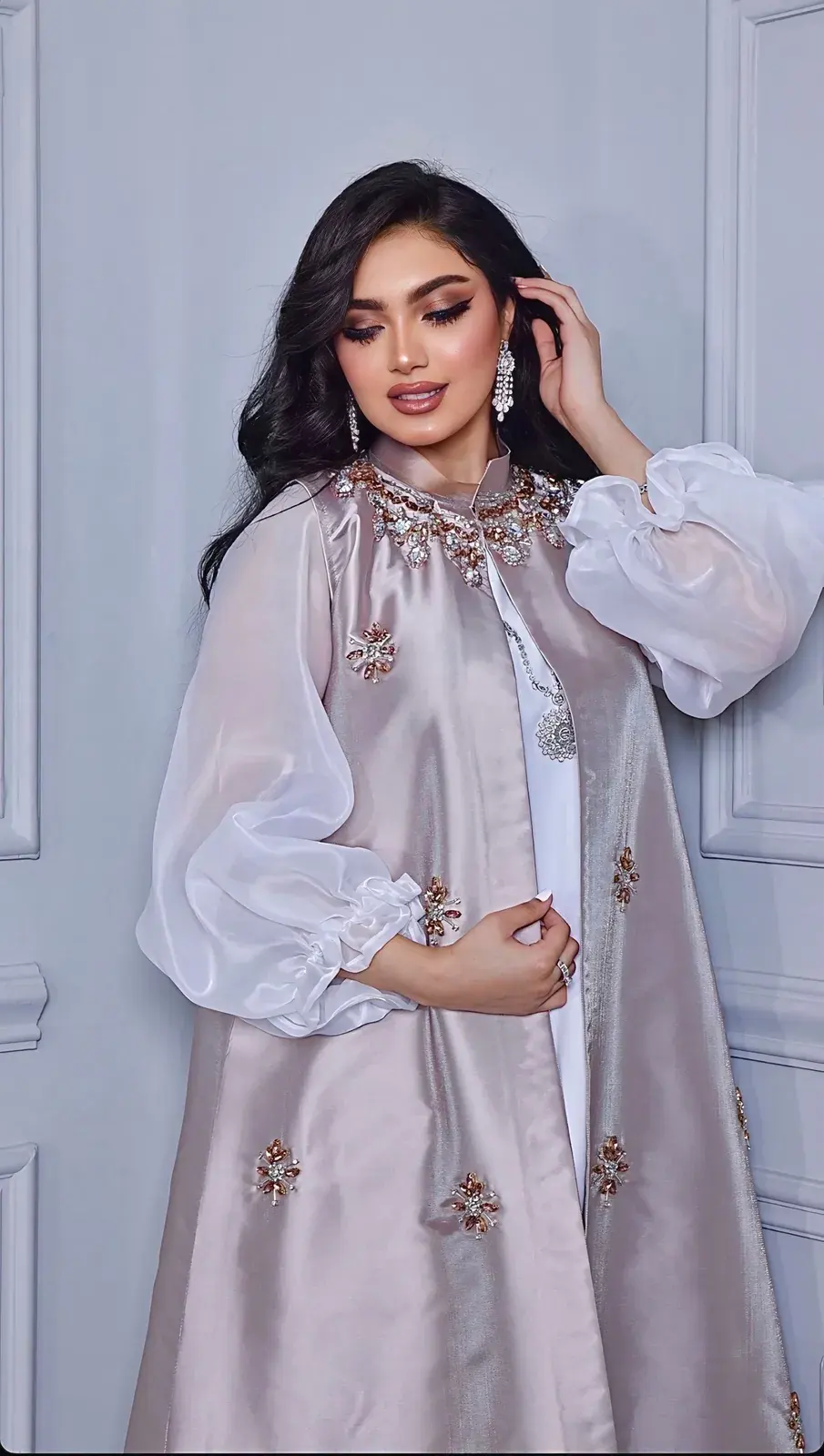 Model in a lilac-grey satin set with sheer organza sleeves and beaded flowers